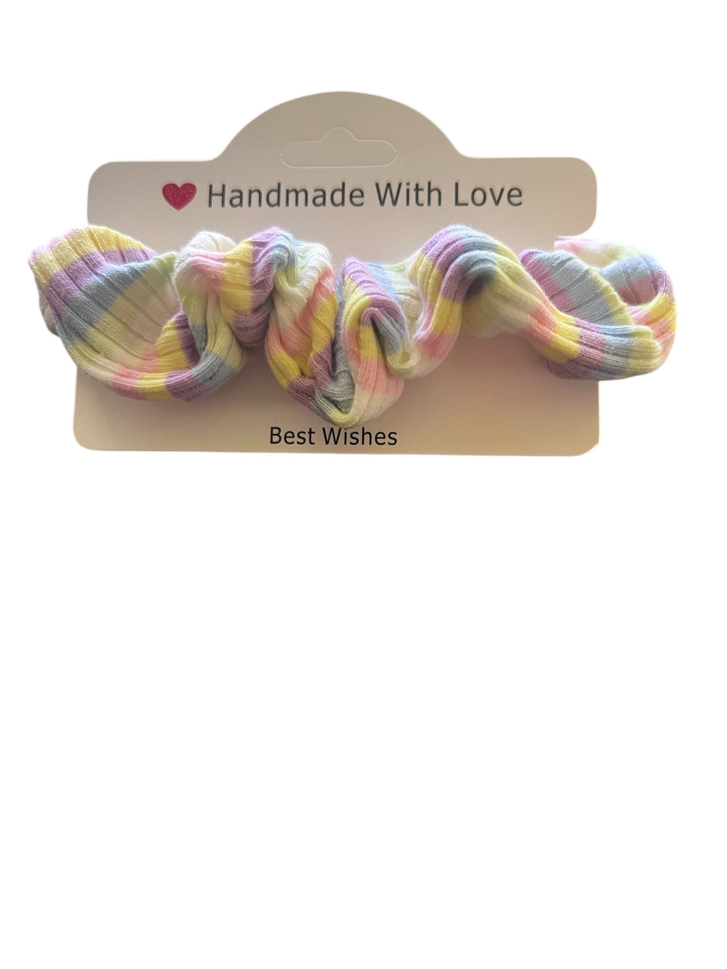 Pastel-colored scrunchie on a wooden stand with 'Handmade With Love' text.
