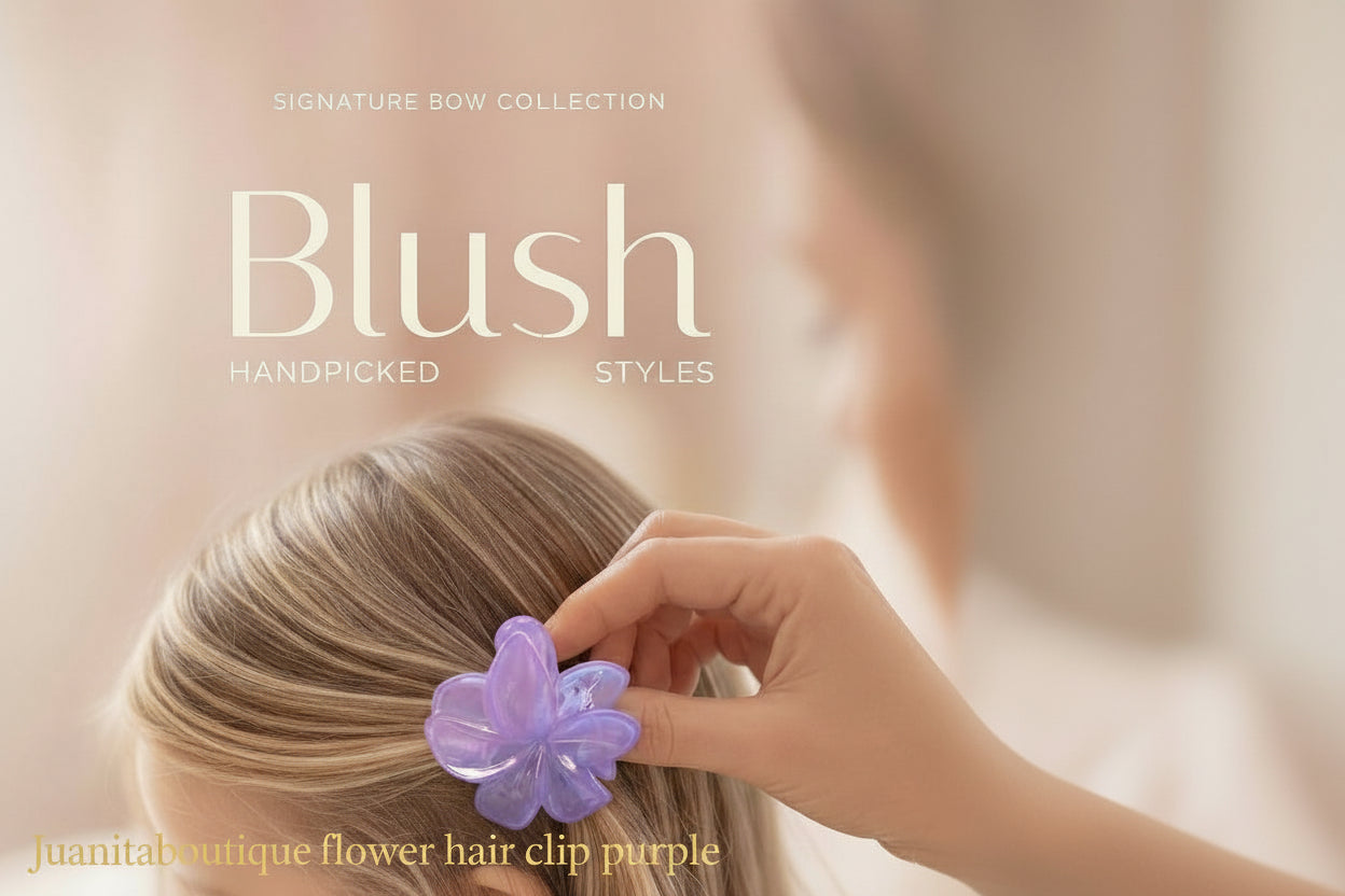 "Purple flower hair clip held in hand — Juanita Boutique