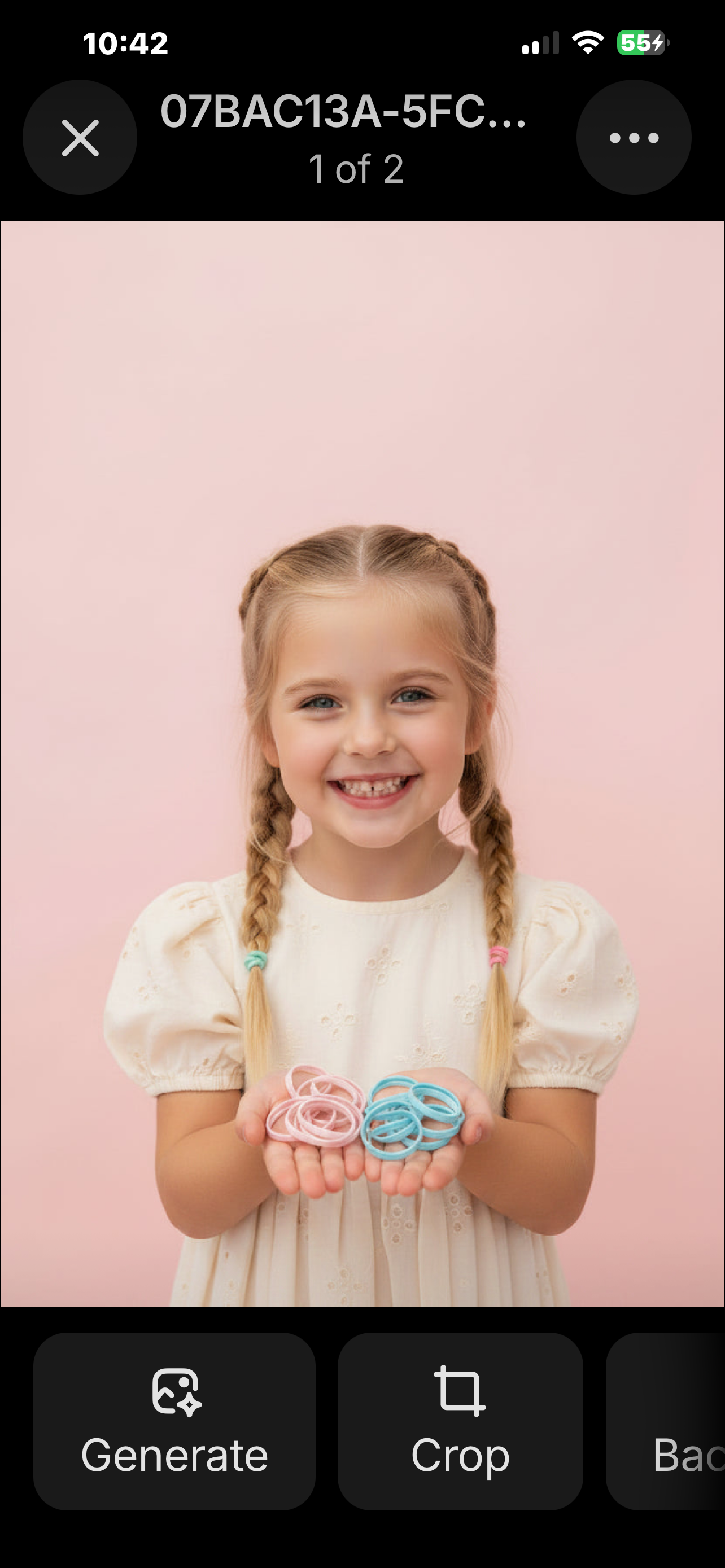 Young girl with braided hair holding two small objects against a pink background of butterfly hair clips 