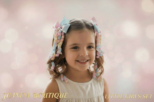 Young girl with colorful hair ties in her hair against a soft pink background