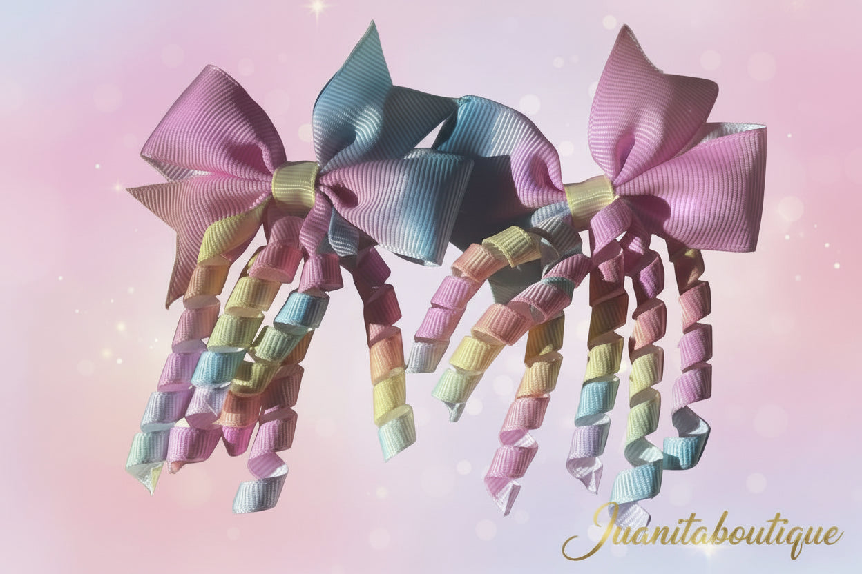 Pastel-colored hair bows with a sparkling background, featuring the brand 'Juanita boutique'.